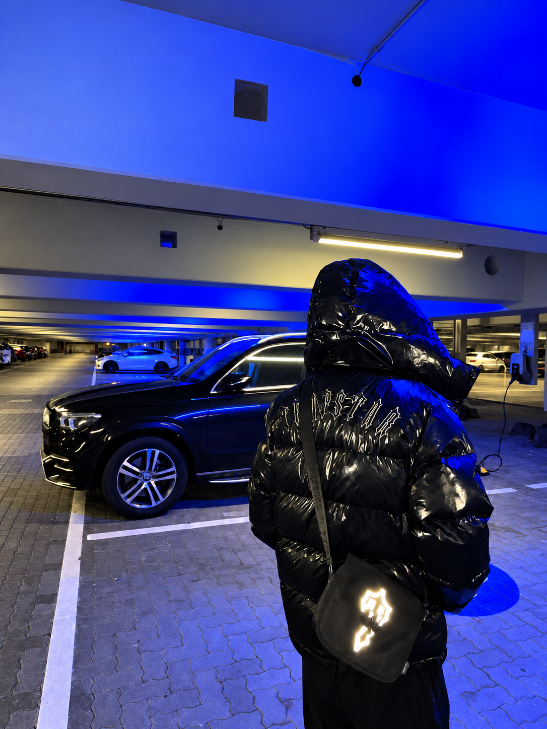 YGODOWN in a blue-lit car park
